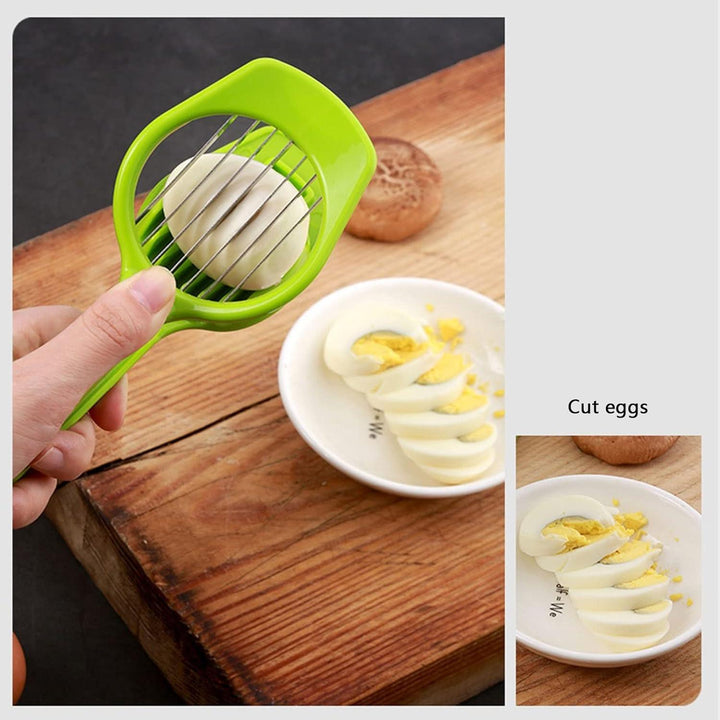Green multipurpose slicer for fruits and eggs with a hand holding it over sliced eggs on a plate