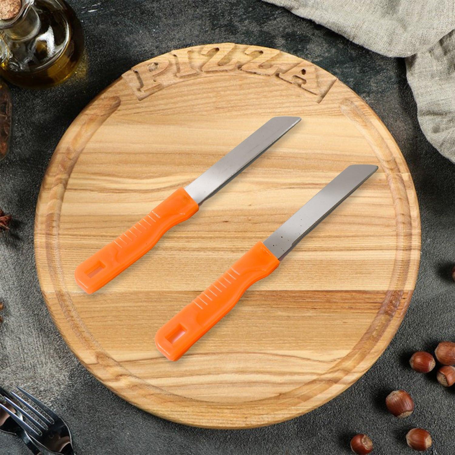Multipurpose stainless steel kitchen knife set on a wooden pizza board with an orange handle design