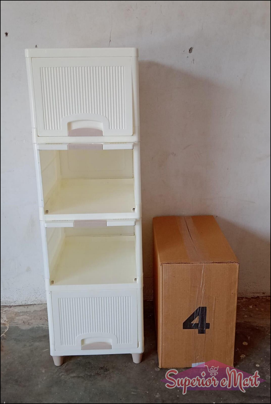 White multipurpose storage cabinet with drawers next to a cardboard box for versatile home organization