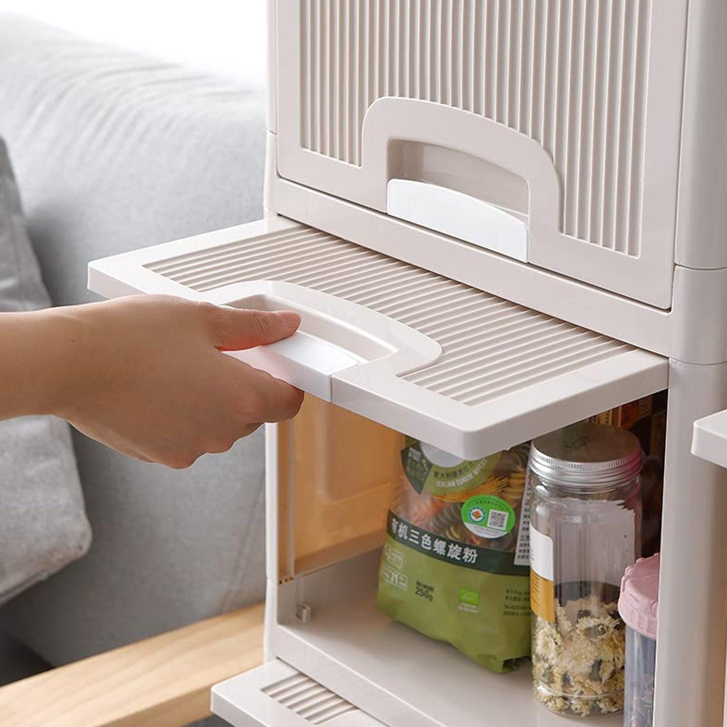 User pulling out a drawer from a multipurpose storage cabinet with drawers for easy access to items