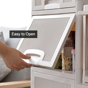 Hand opening the drawer of a multipurpose storage cabinet with drawers in a modern kitchen setting