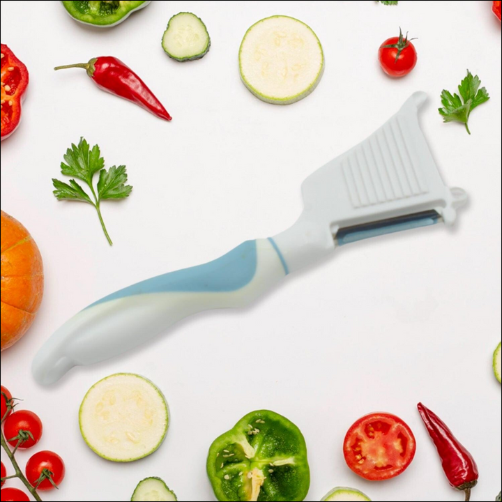 Multipurpose vegetable peeler brush with ergonomic handle surrounded by fresh vegetables