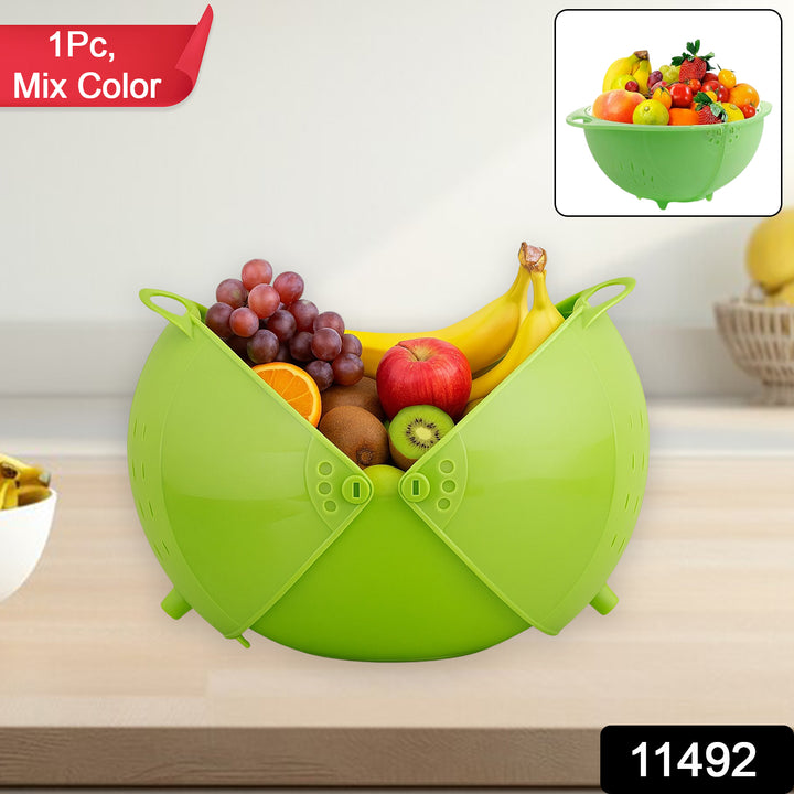 Green multiuse fruit and vegetable bowl filled with various fresh fruits on countertop