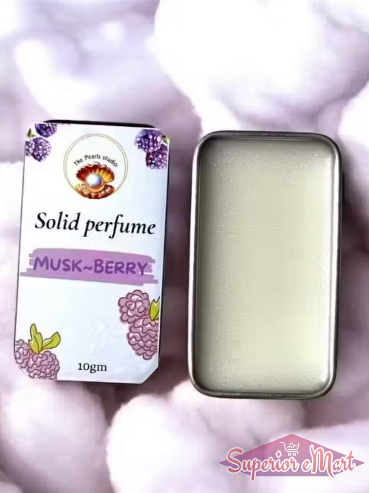 10g Musk-Berry solid perfume by The Pearls studio in a metal tin with white balm, on a soft white fluffy background.