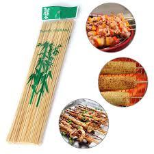 Pack of natural bamboo skewers ideal for grilling and outdoor cooking with various food options