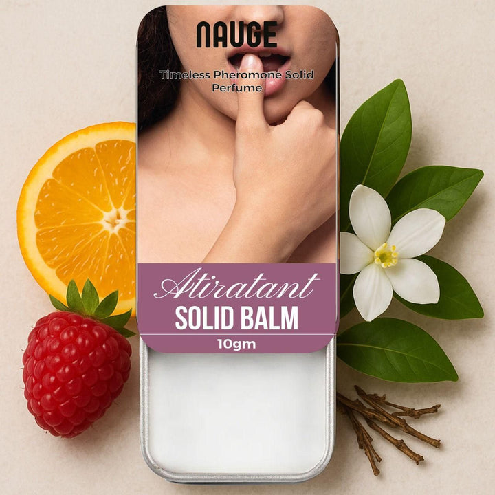 Nauge Atirant pheromone solid perfume solid balm in a tin with citrus, raspberry, white flower, and twig accents