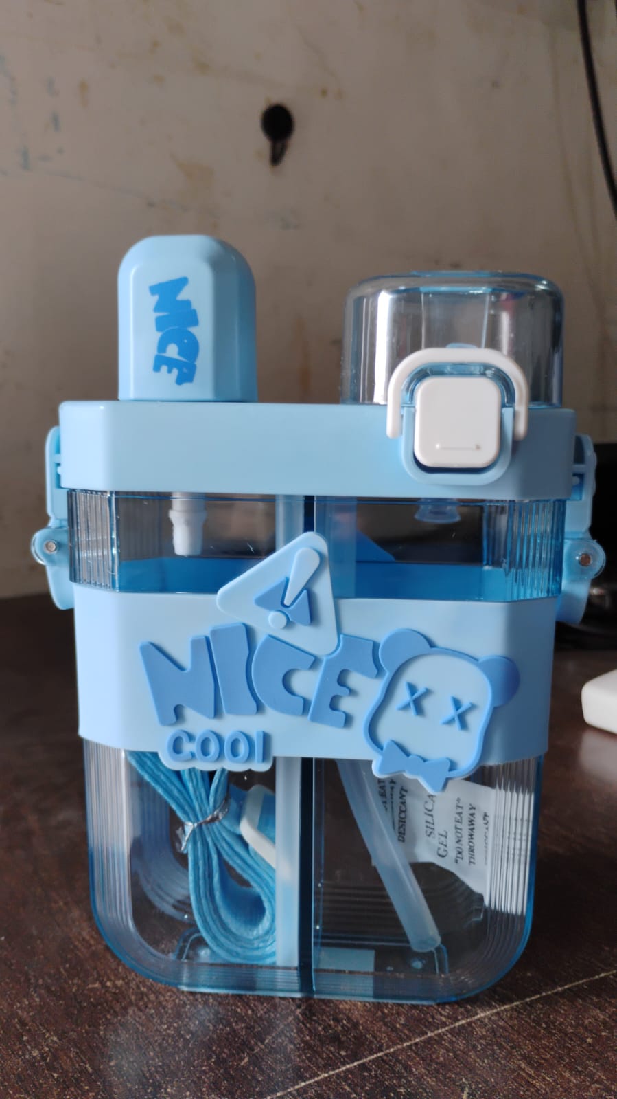 Blue dual compartment water bottle with built-in straw and stylish design for easy hydration