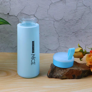 Leak proof glass water bottle in light blue with a secure lid for on-the-go hydration