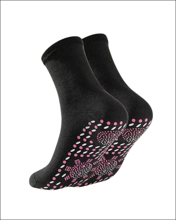 Pair of black crew socks with a textured pink and white non-slip pattern on the soles.