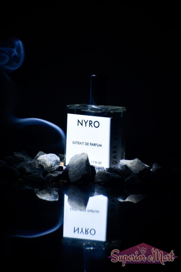 Nyro Extrait de Parfum with Dark Edge in a sleek bottle surrounded by stones and smoke