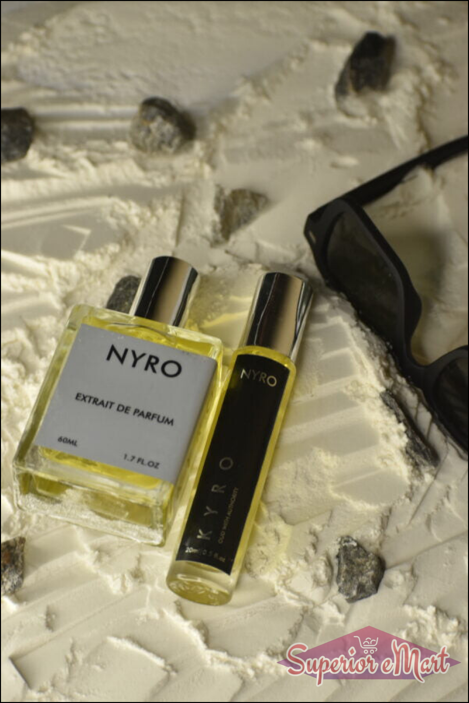 Nyro Elite Set featuring Extrait de Parfum and travel spray on textured surface