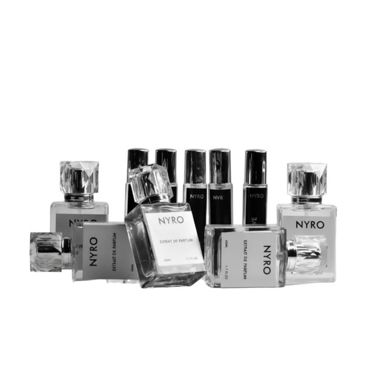 Collection of Nyro perfume bottles on a gray background