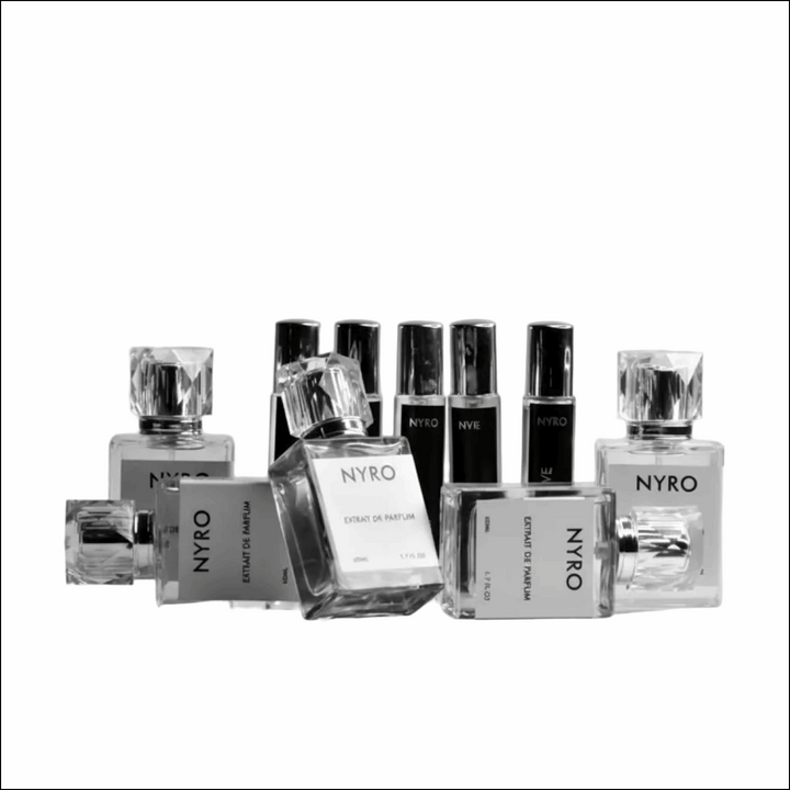 Collection of Nyro perfume bottles on a gray background