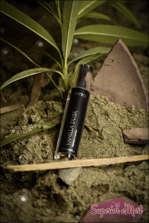 Nyro Vanilla Dusk Perfume in a sleek bottle surrounded by natural elements