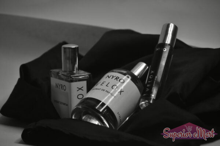 Nyro Velox Perfume Set Featuring Three Bottles of Fragrance on Black Fabric