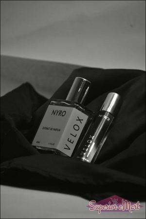Nyro Velox Perfume Bottles on Black Silk with Elegant Packaging for a Luxurious Fragrance Experience