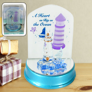 Ocean Lighthouse night light featuring a beautifully designed lighthouse with a blue base