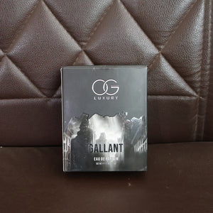 Og Beauty Gallant Eau De Parfum box displayed on a brown leather couch
