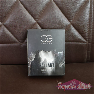 Og Beauty Gallant Eau De Parfum box displayed on a brown leather couch