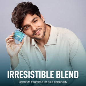 Og Beauty Luxury Shadow perfume in blue bottle held by a man showcasing its bold fragrance appeal