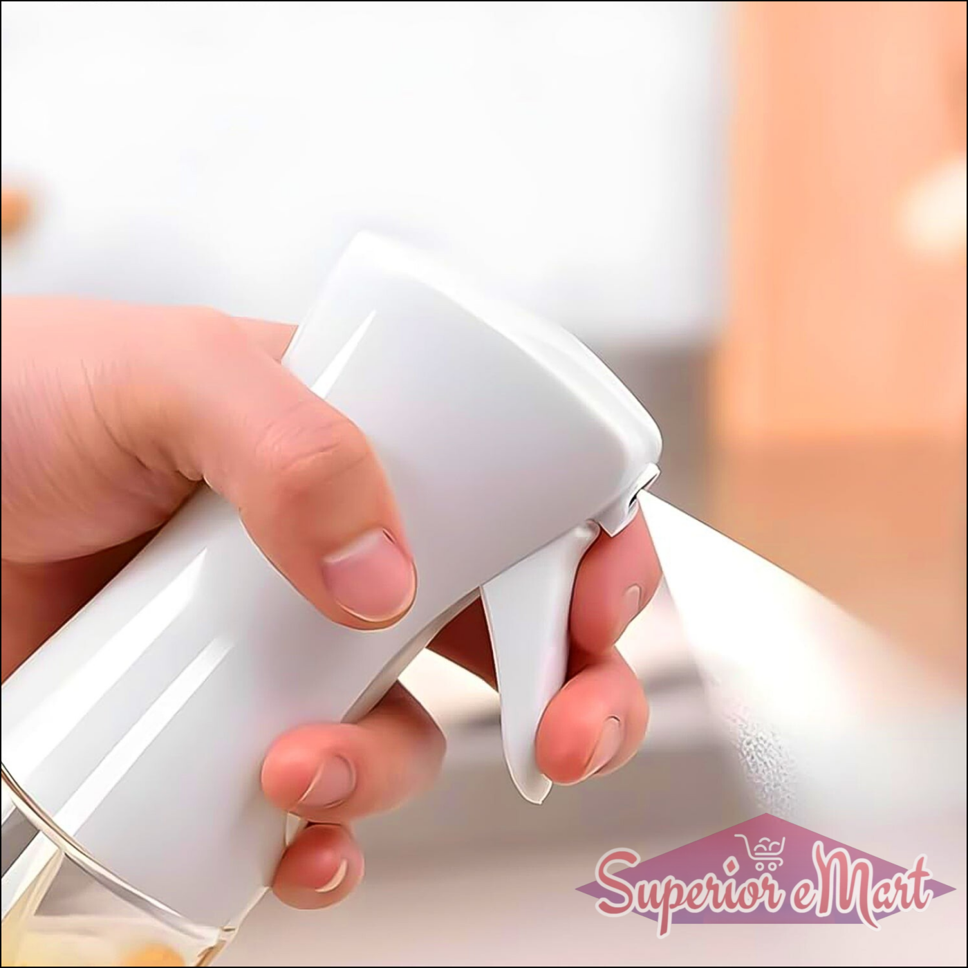 Hand holding a white oil spray bottle for cooking, perfect for even oil distribution on food