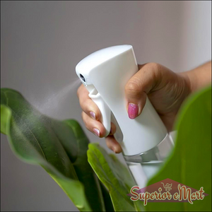 White ergonomic oil spray bottle for cooking, ideal for even oil distribution during meal preparation