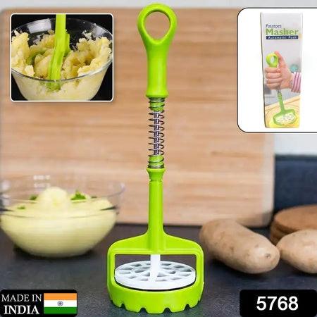 Green one-handed potato masher with ergonomic handle for easy mashing and meal prep