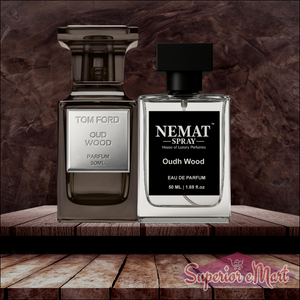 Tom Ford Oud Wood (smoky grey) and Nemat Oudh Wood (clear) 50ml perfume bottles on a rustic wooden shelf.