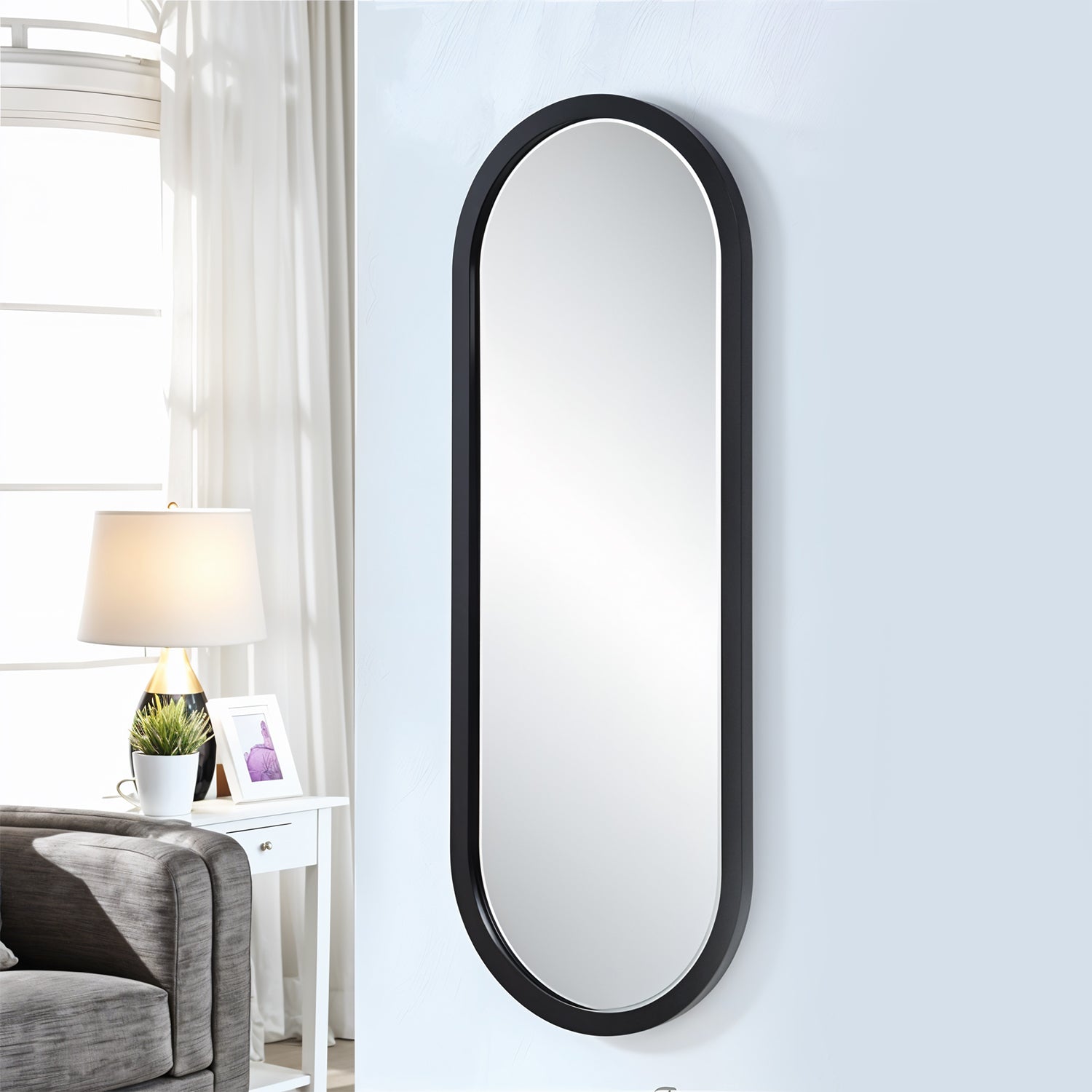 Oval Wall-mounted Bathroom Mirror (1 Pc) with a sleek black frame, perfect for modern bathrooms