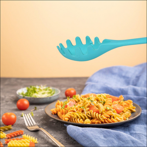 Heat resistant pasta fork in turquoise color serving pasta on a gray plate with fresh vegetables