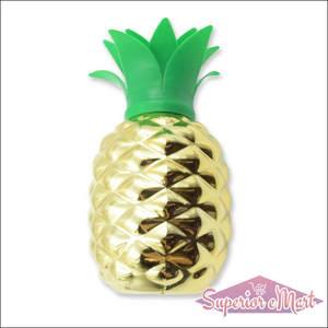 Gold pineapple cup with straw featuring a vibrant green crown perfect for summer drinks
