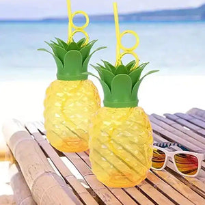 Colorful pineapple cup with straw set for summer parties and tropical drinks at the beach