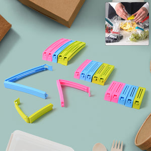 Colorful plastic pouch sealer clips in blue, pink, and green for sealing bags and food storage