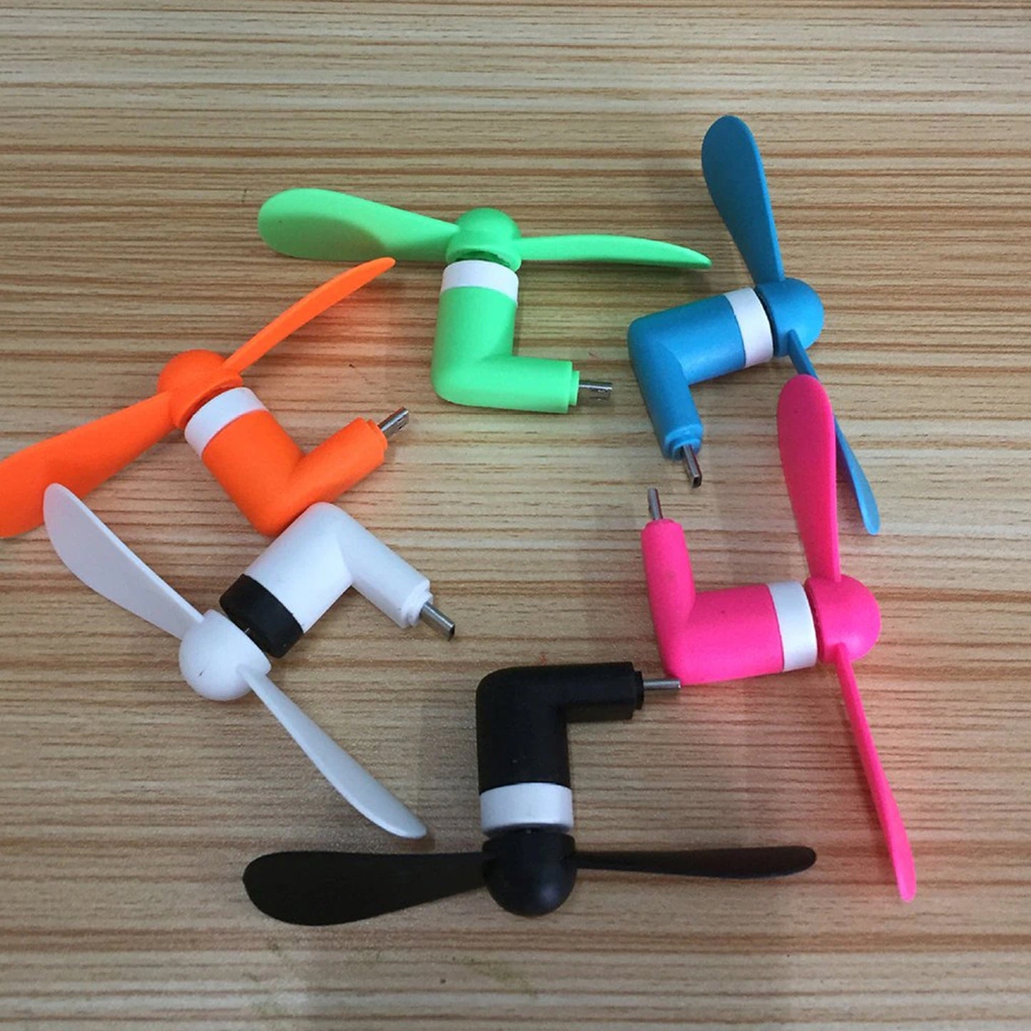 Colorful portable USB fan with multiple blades in six vibrant colors for kids' fun and cooling