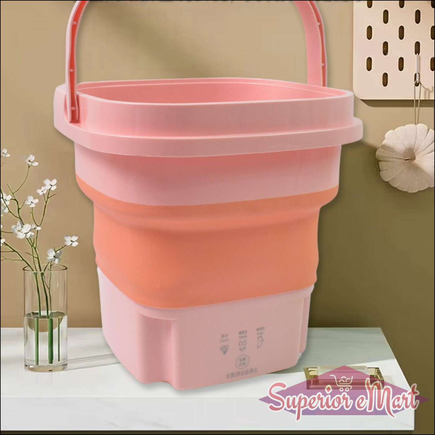 Pink foldable portable washing machine with ergonomic handle for space-saving laundry needs