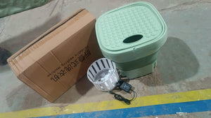 Portable washing machine foldable with compact design, includes a basket and power cord for easy use