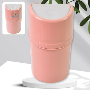 Mini trash can with lid in pink color, perfect for small spaces and easy waste disposal.