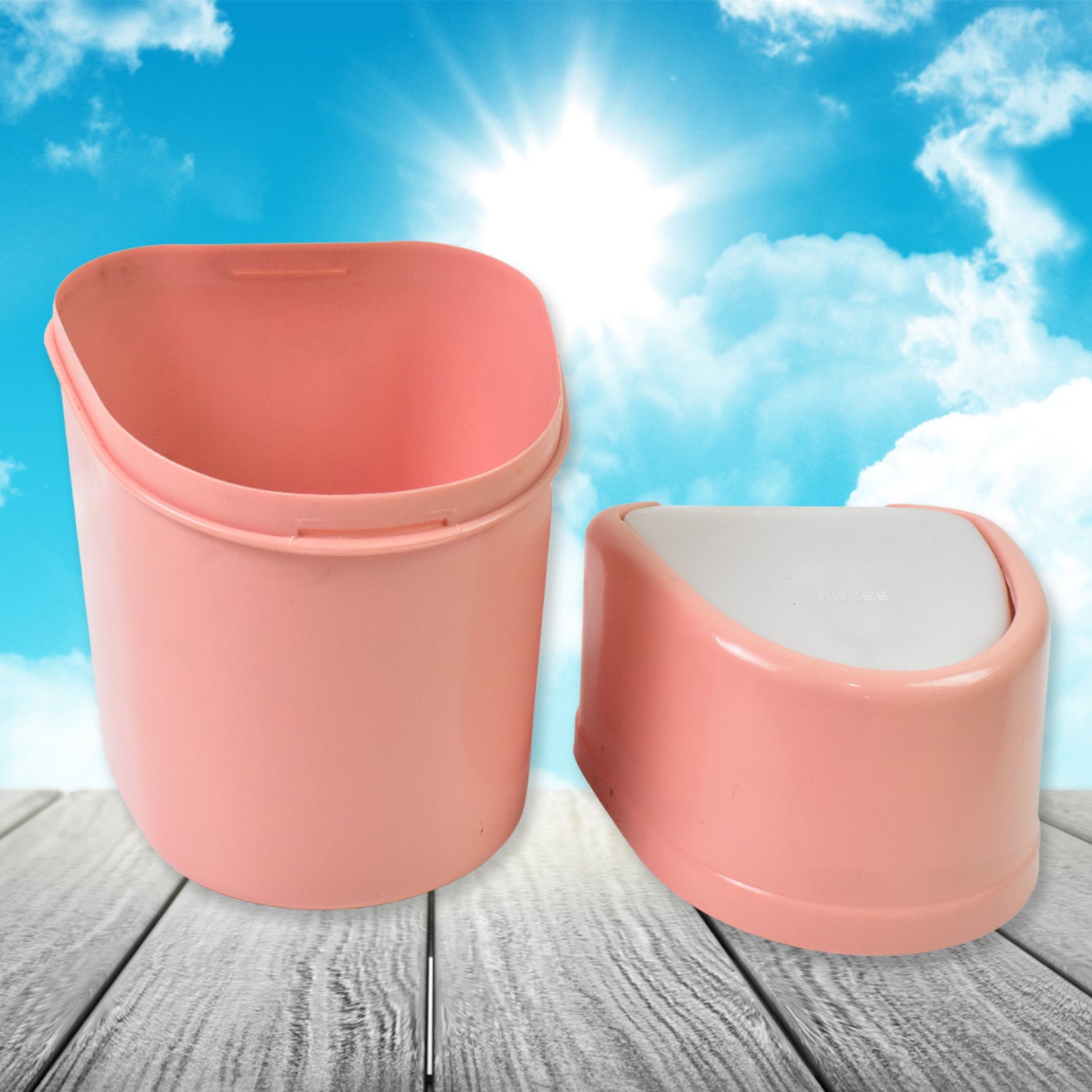 Pink mini trash can with lid designed for home and kitchen use on a wooden surface
