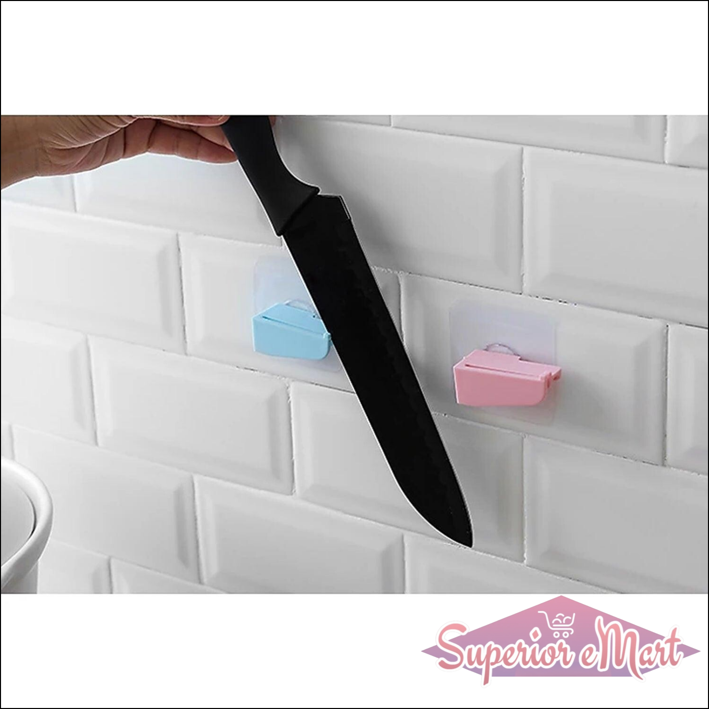 Punch free knife holder mounted on a wall with a hand placing a knife in it