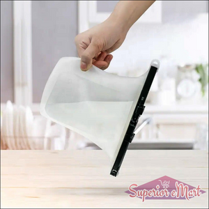 Hand holding a reusable silicone food storage bag for safe food storage and organization