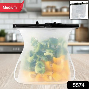 Reusable silicone food storage bag holding chopped vegetables on a kitchen counter