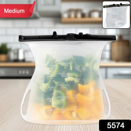 Reusable silicone food storage bag holding chopped vegetables on a kitchen counter