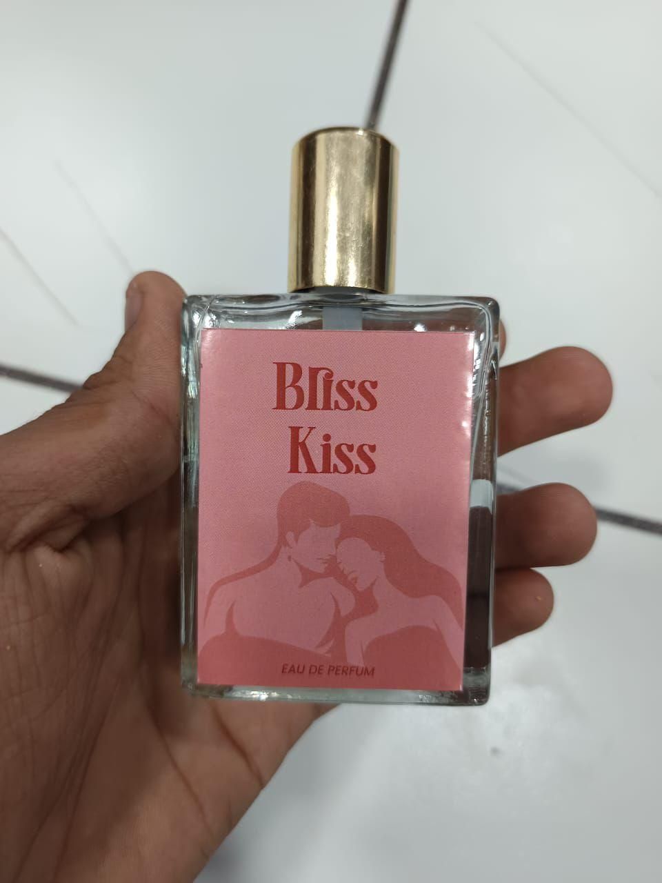 Bliss Kiss Romantic Kiss Perfume in a glass bottle featuring a romantic couple design