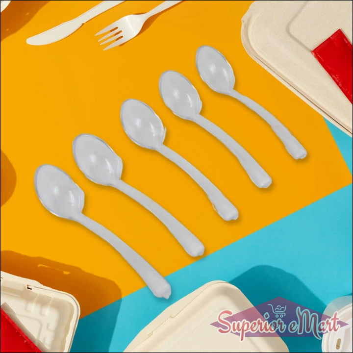 Durable plastic spoons in various sizes on a colorful background for dining and kitchen use