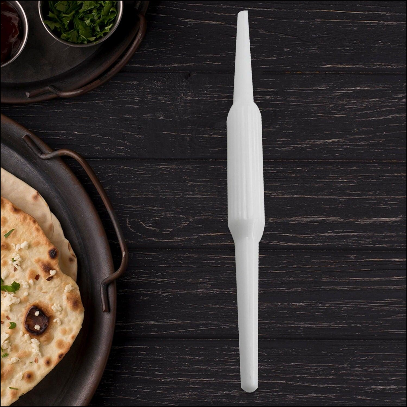 Roti maker belan for easy rolling of flatbreads with side dishes in a traditional kitchen setting