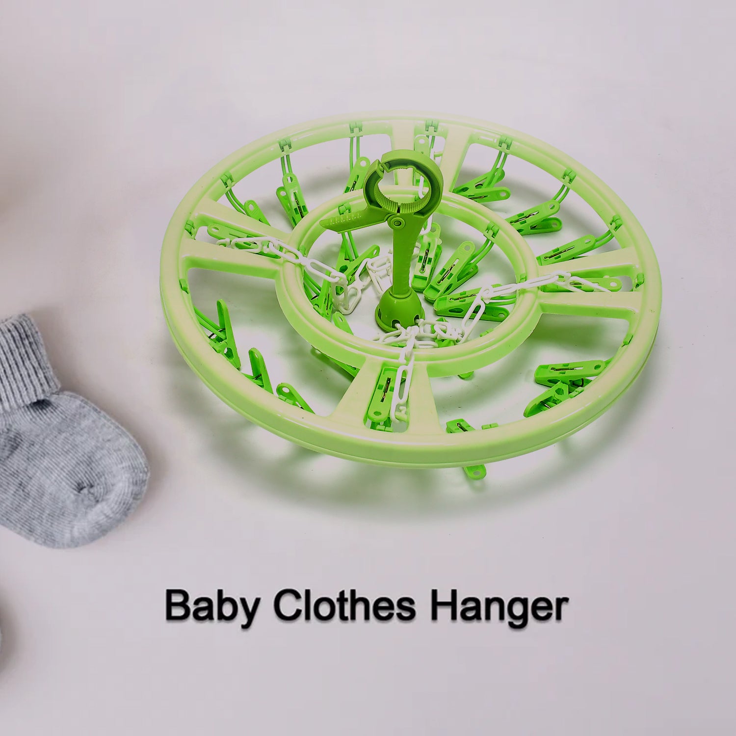 Round hanger with clips for drying baby clothes, featuring a compact and lightweight design
