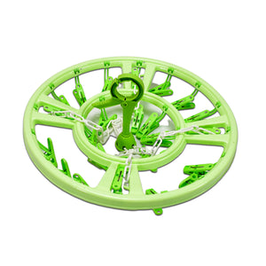 Green round hanger with clips for baby care laundry drying and organizing clothes efficiently