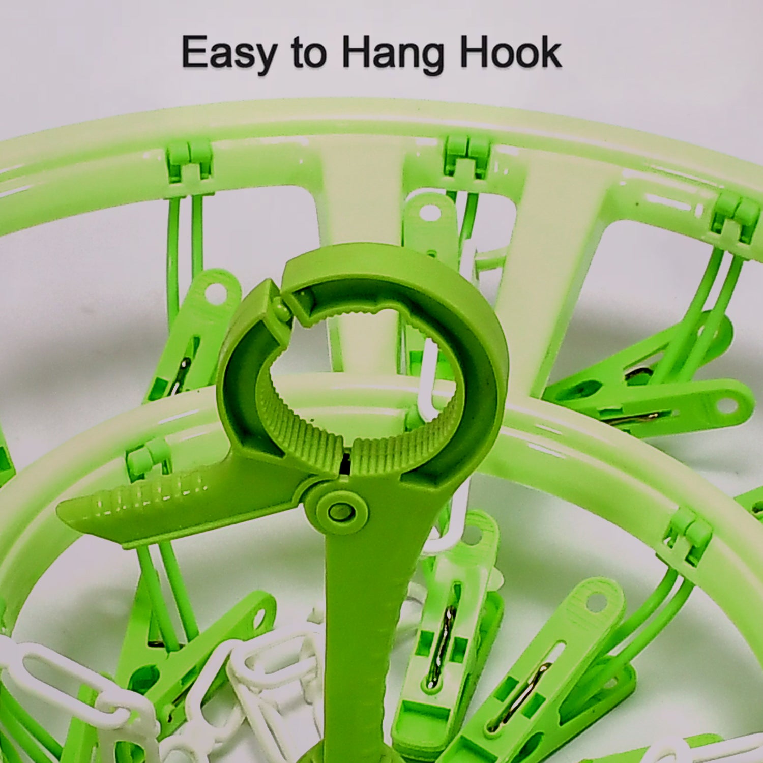 Green round hanger with clips featuring an easy to hang hook for convenient baby care organization