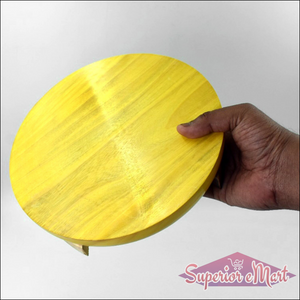 Wooden round roti maker for home use with a smooth yellow finish and a sturdy design