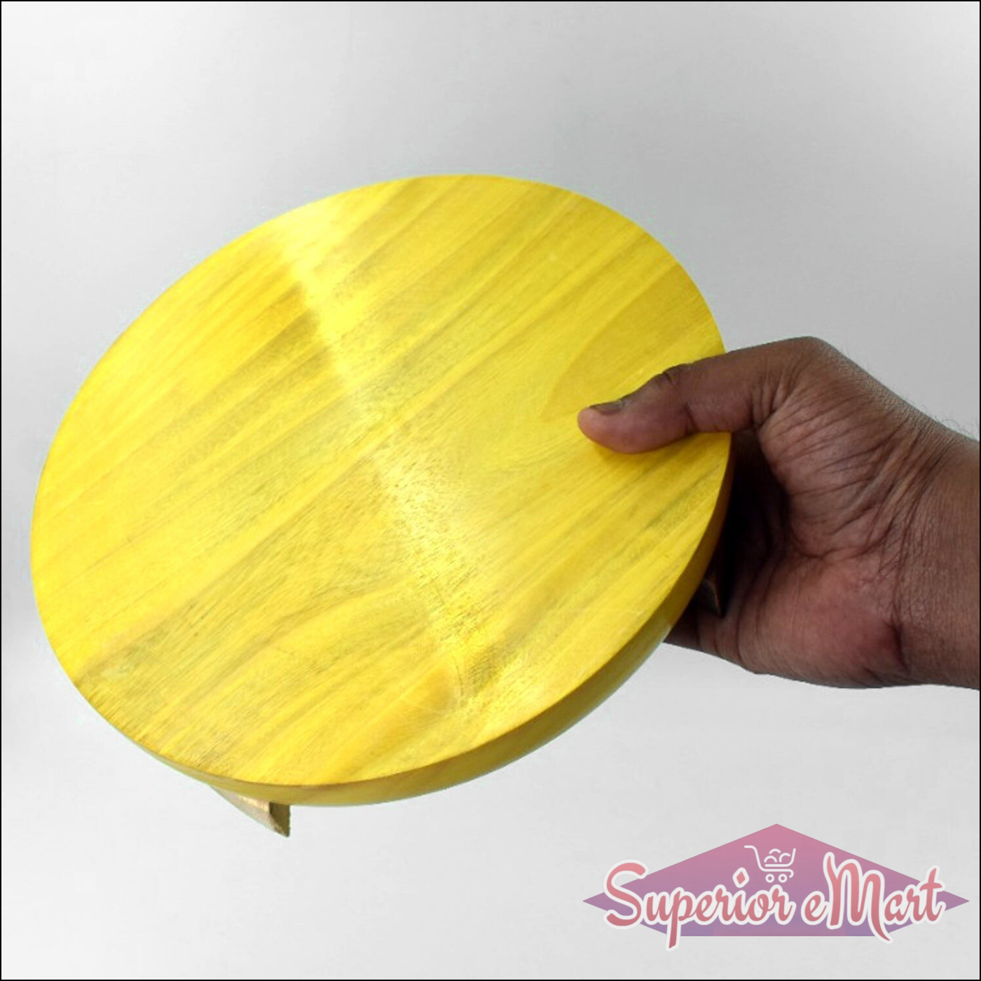 Wooden round roti maker for home use with a smooth yellow finish and a sturdy design